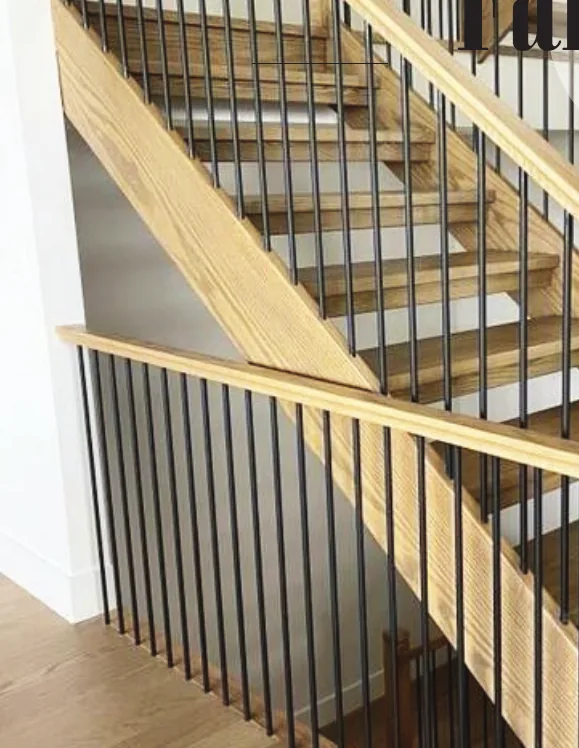 Farmhouse oak staircase with square newels and black iron balusters