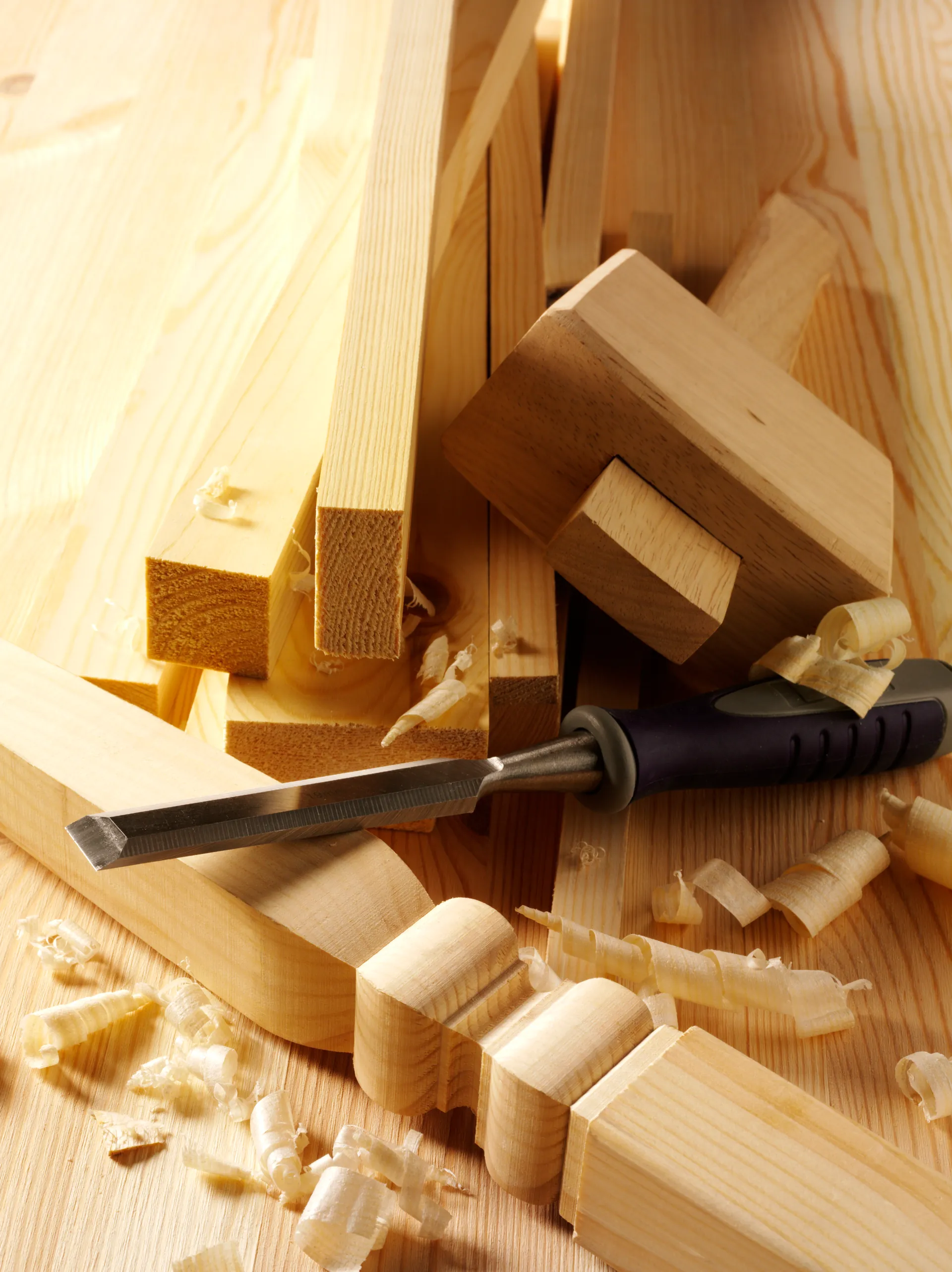 Snyder Stairs craftsman working timber with chisel and mallet