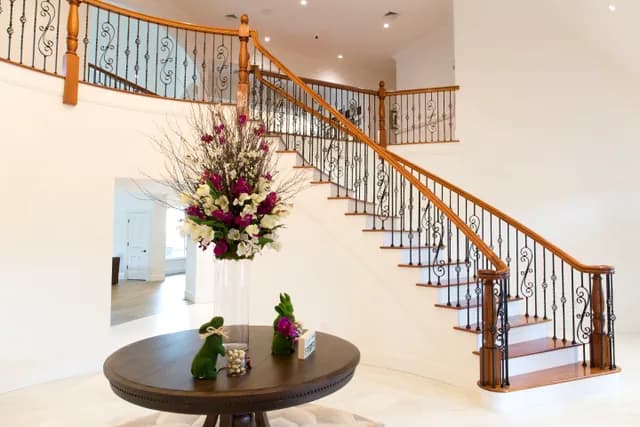 Custom oak staircase with iron balusters built by Snyder Stairs in Whitehall, PA