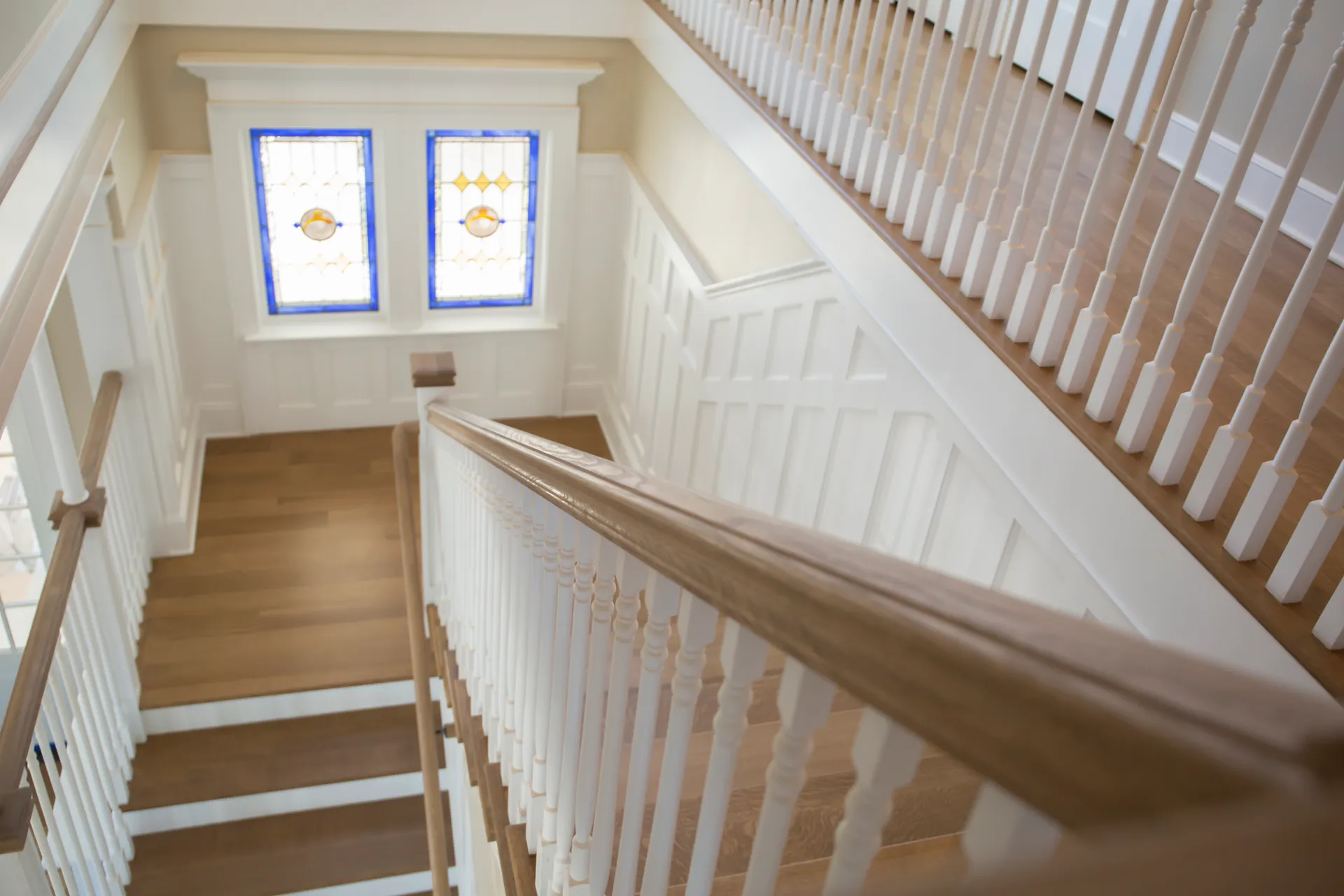 Custom oak staircase with iron balusters built by Snyder Stairs in Whitehall, PA